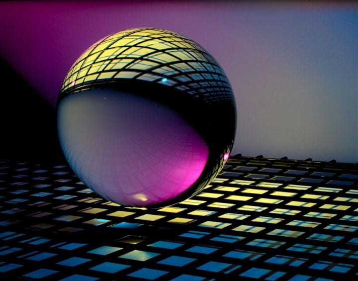 A glass ball resting on a grid pattern