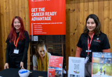 Two La Trobe student ambassadors at a stall promoting the Career Ready Ambassador program