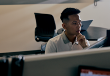 A student works at a computer.