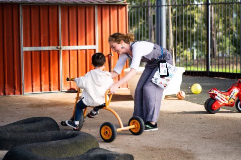 Carer and child playing